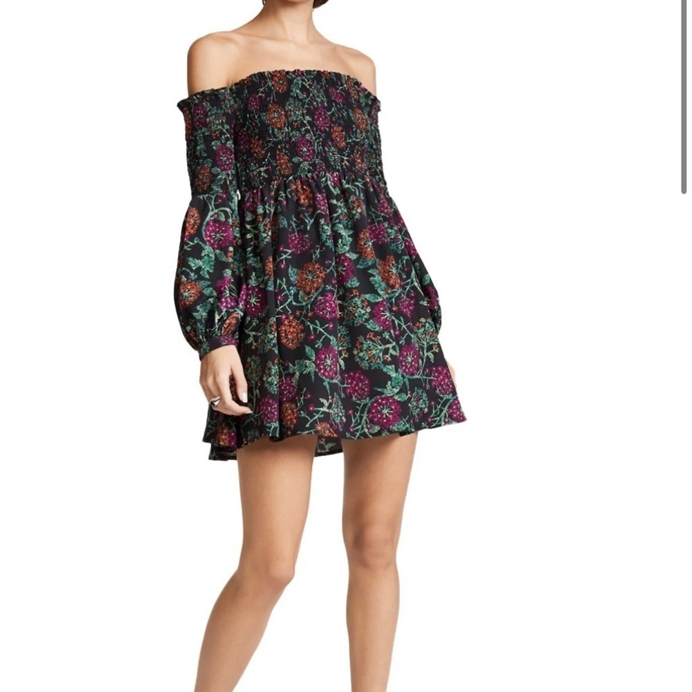 Likely off the shoulder smocked purple floral dress
